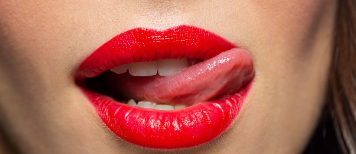Woman licking lips