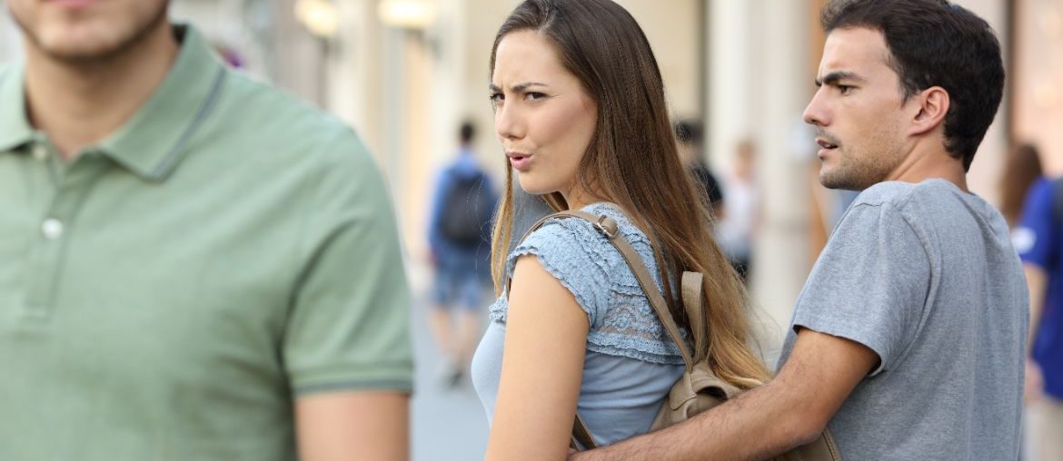 Woman looking at different man